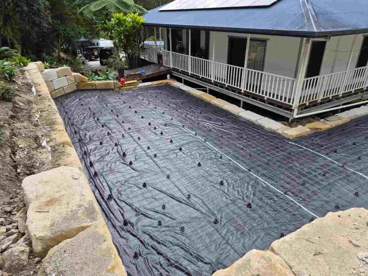 Concrete slab preparation with formwork, plastic membrane and reinforcement mesh